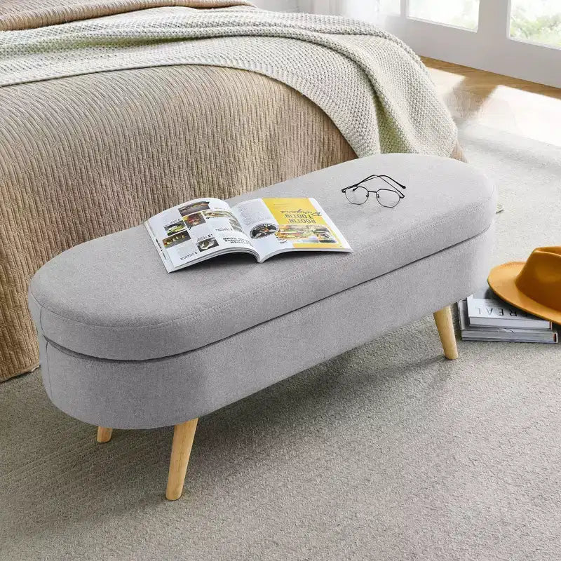 Banc ottoman de rangement ovale Okak Modern en lin avec pieds en bois d'hévéa, long repose-pieds de rangement souple pour salon, entrée, chambre à coucher
