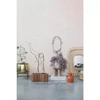 Miroir mural tissé en rotin à cadre pétale Storied Home, naturel